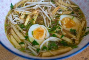 Surinamese Javanese saoto soup with garnishes recipe