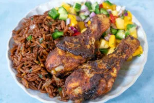 Surinamese brown nasi with curry chicken and Caribbean salsa